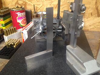 angle plate and hight gage on a surface plate to align